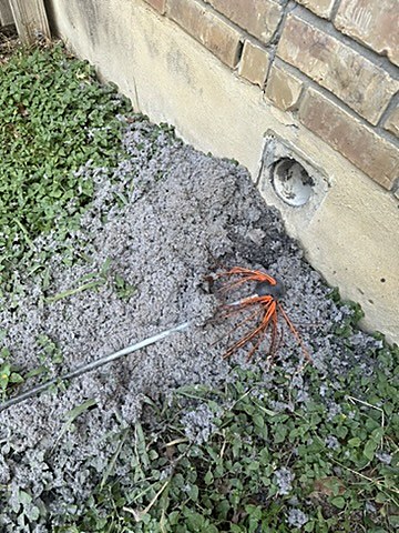 Large pile of lint removed from a clogged dryer vent in Austin